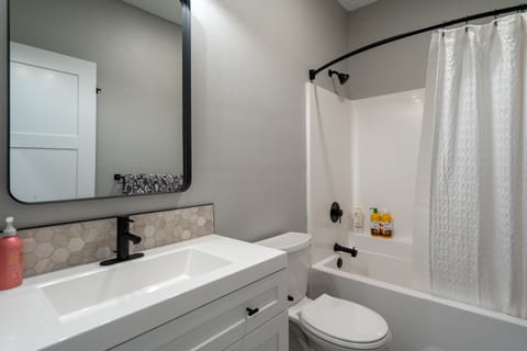 Combined shower/tub, hair dryer, towels, soap