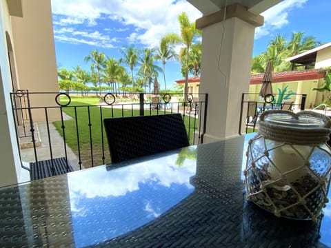 Patio is steps from the saltwater pool and steps to the ocean.