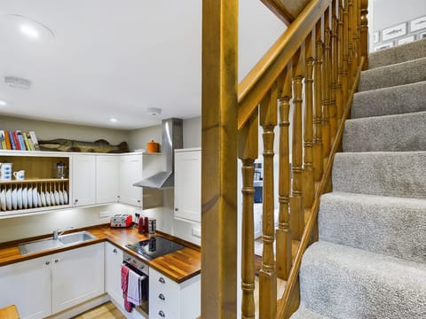 Stairs and view of Kitchen