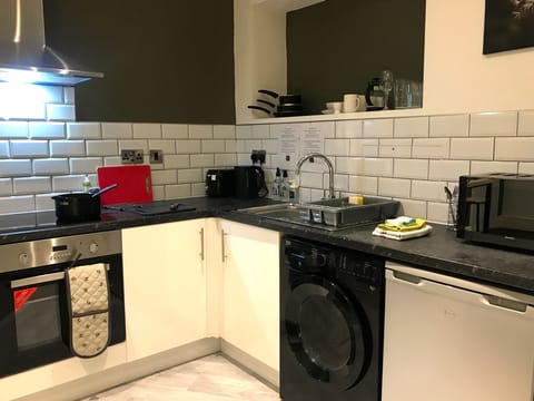 Fully equipped kitchen with washer / dryer, electric hob, fan oven. microwave, toaster, kettle and fridge