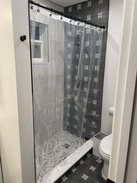 Combined shower/tub, hair dryer, towels, toilet paper