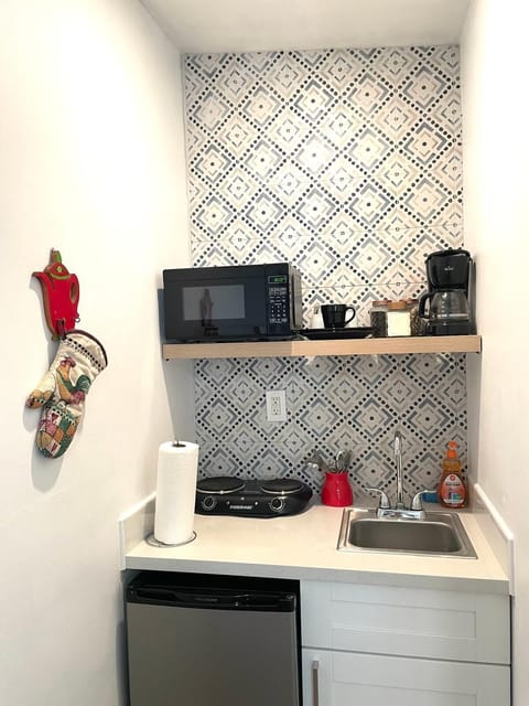 Fridge, microwave, coffee/tea maker, paper towels