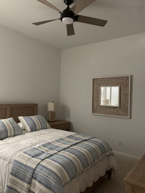 Second guest bedroom with queen size bedroom and smart tv.