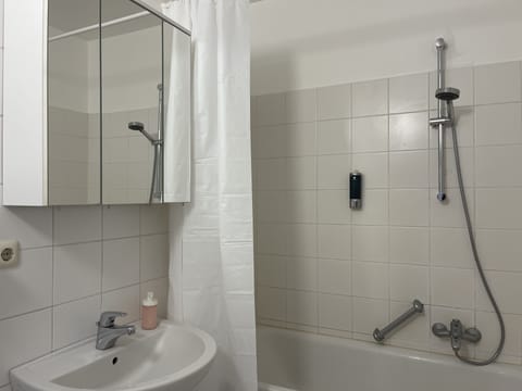 Combined shower/tub, hair dryer, towels, soap