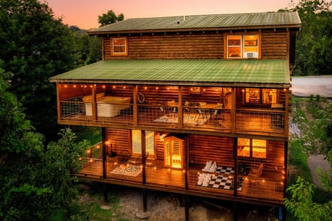 Our 3 story cabin features 2 decks with hot tub, sauna, and games.