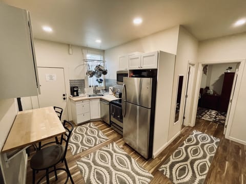 hall way leading into our well stocked, newly renovated kitchen