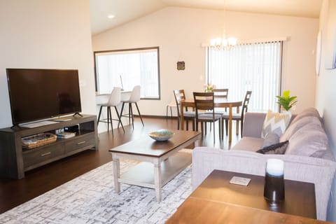 Main level living room, dining area and kitchen