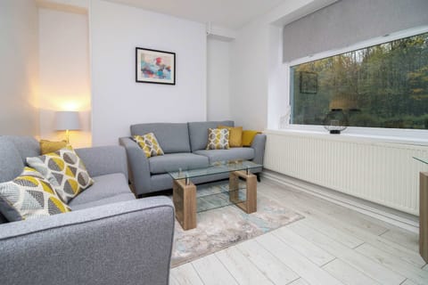 Comfortable living space with woodland view