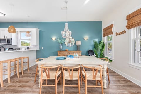 Look at those coastal colors in the dining room and kitchen!