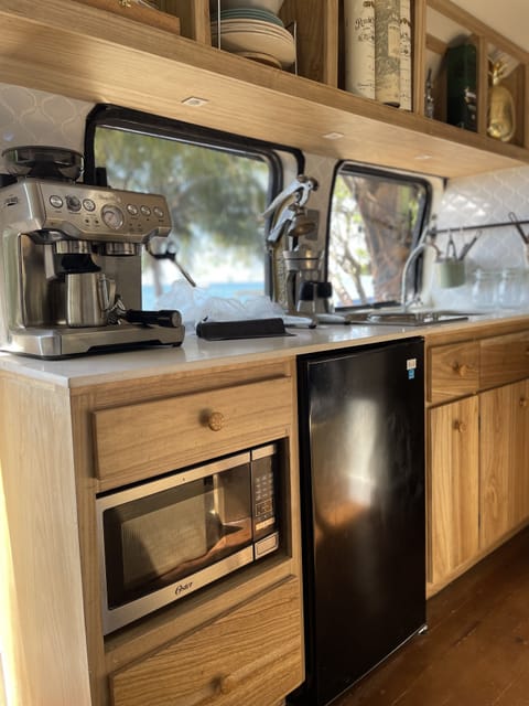 Fridge, microwave, stovetop, coffee/tea maker