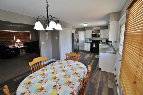 Dinning room  new flooring throughout home and newer furniture 
