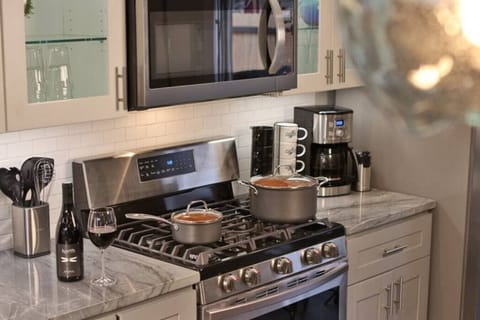 Main floor kitchen with cooking pots and drip coffee
