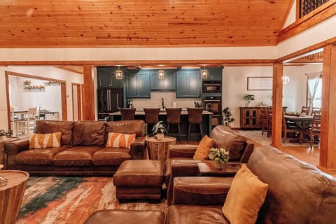 The living room and kitchen are open to two dining areas. 