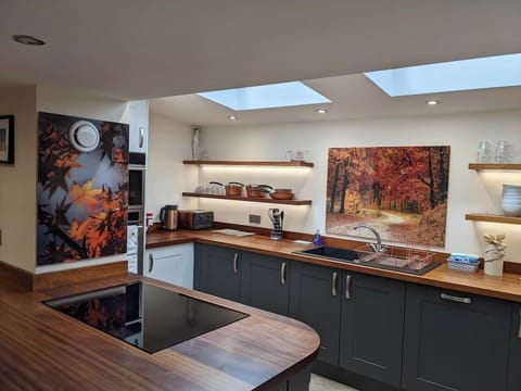 The modern & stylish kitchen is fully equipped with everything you need: electric oven and grill, induction hob, toaster, coffee maker, kettle, American-style fridge freezer, d/washer & w/machine. We leave a starter pack with some essentials.