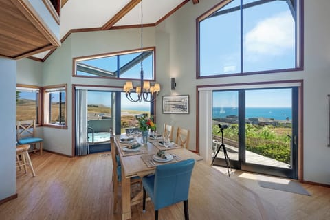 The dining table seats 6-8, with 2 extra chairs in the bnook, plus seating at the counter.