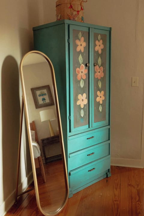 A place to store your clothes and a full length mirror to keep you looking your best