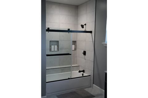 Combined shower/tub, hair dryer, towels, soap