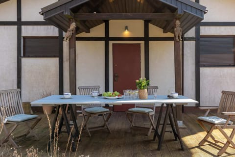 The terrace's stylish decor complements the hause's modern design.