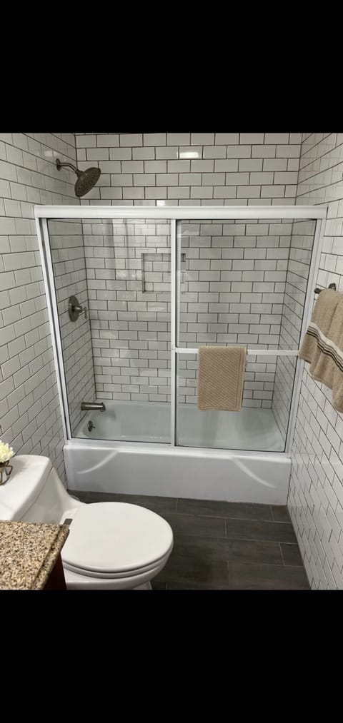 Combined shower/tub, hair dryer, towels, toilet paper