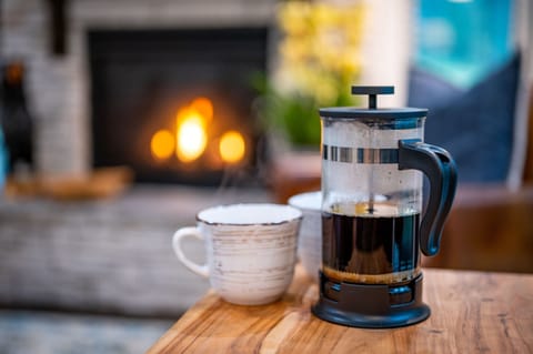 Savor the simple pleasure of enjoying a cup of coffee amidst the beautiful surroundings, where the aroma blends with nature's tranquility, creating a harmonious moment of bliss that invigorate