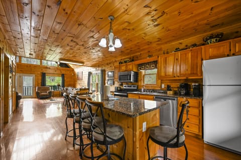The kitchen island provides additional seating or space for prep
