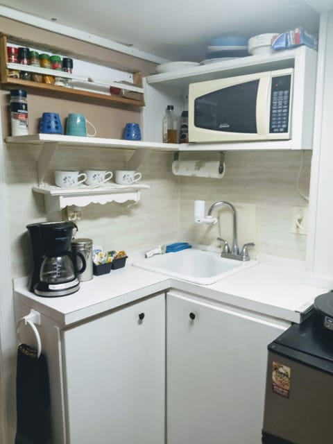 Fridge, microwave, toaster oven, cookware/dishes/utensils