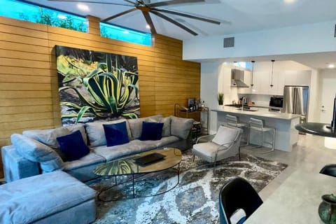 Great room with view to the kitchen. Includes upscale designer furniture.