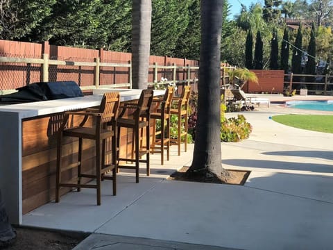 15 foot built in bbq with gas, charcoal and frige ameneties.