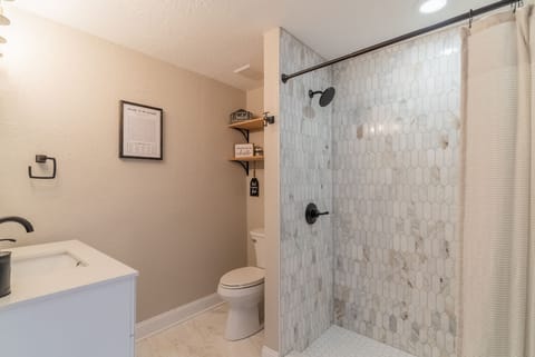 Combined shower/tub, hair dryer, towels, soap