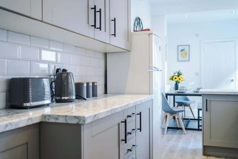 The fully equipped open plan kitchen/dining area has everything you need for a short and long term stay in Crewe. 