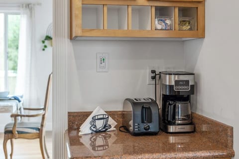 Additional counter surface in the kitchen. Coffee is provided!