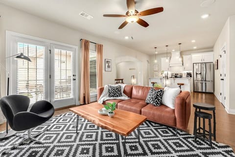 If you follow the entry hallway to the end, you'll enter our bright, open concept living, kitchen and dining area.