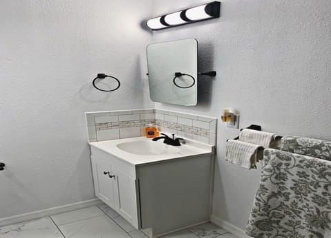 Combined shower/tub, hair dryer, towels, soap