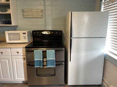 Full size appliances, basic spices, oil and coffee/tea with condiments.