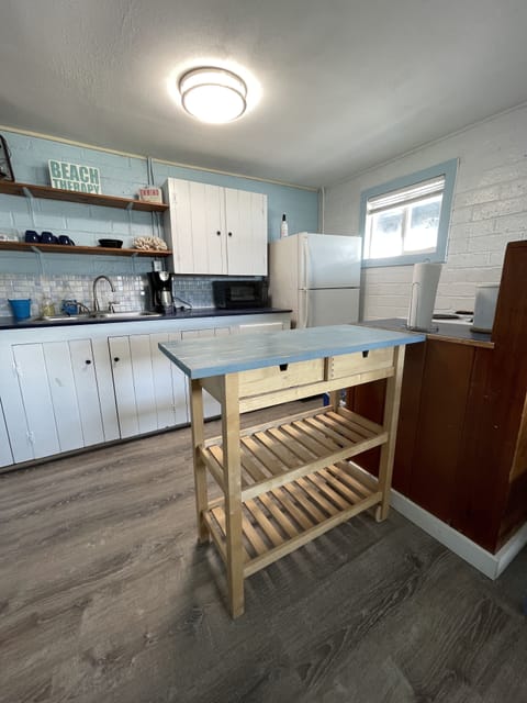 Well stocked kitchen with most anything you need to prepare and serve a meal.