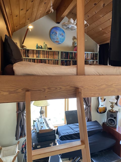 Queen mattress in loft/library.
