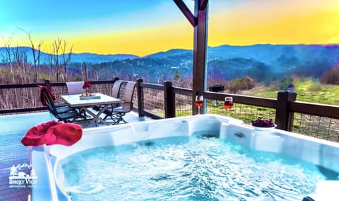 Hot Tub Paradise: Unwind in your private hot tub with breathtaking mountain views and sunset sips!