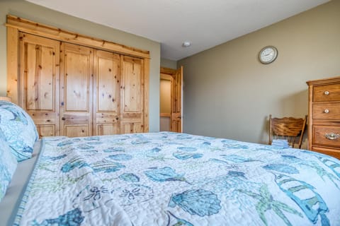 Fourth bedroom with plush bed and linens