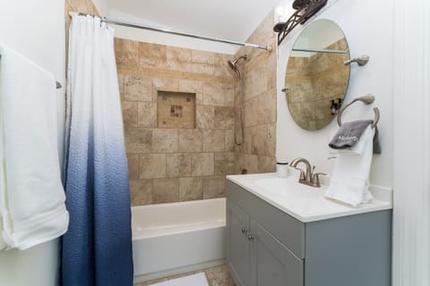 Combined shower/tub, hair dryer, towels, soap