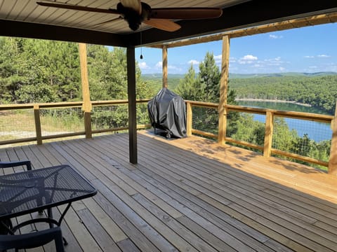 16x20 open deck area with 8x16 covered porch with ceiling fan. 