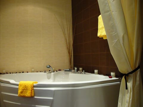 Bathroom | Bathtub, hair dryer, towels, soap