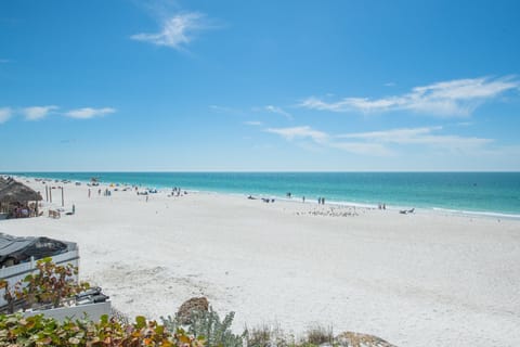 On the beach, sun loungers, beach towels