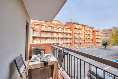 Outside balcony with table and chairs