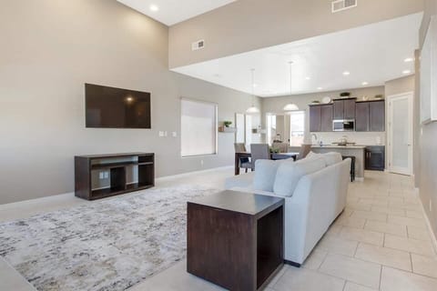 Smart television and living room with lots of space to visit with friends and family