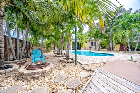 A heated pool, sun loungers