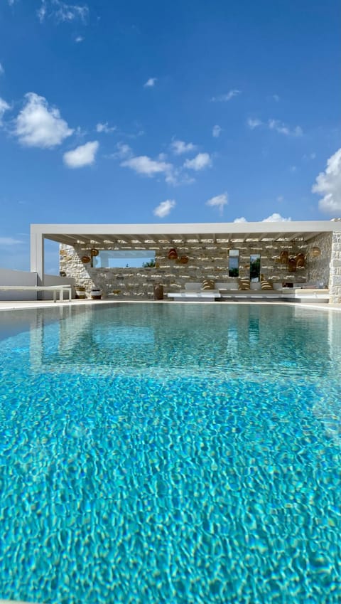 An infinity pool, sun loungers