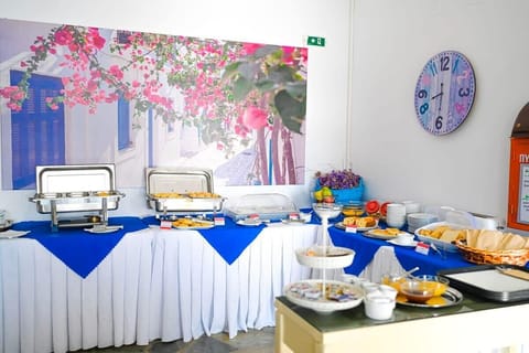 Treat yourself at the rich breakfast buffet, offering a generous spread of sweet and savory delights, including local specialties and seasonal fruits.