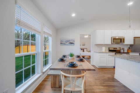 Enjoy meals at modern dining table that seats up to eight.