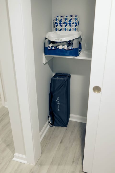 Baby pack n play and booster dining seat for families with young children.