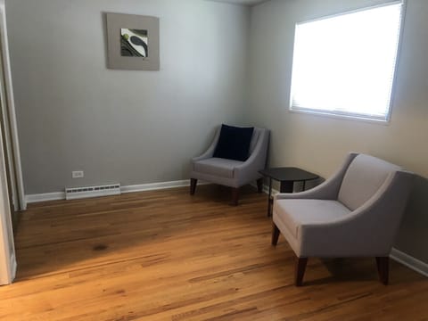 Master bedroom with seats for quite reading or can be modified for office space.